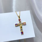 Close-up view of copper cross pendant with gold plating