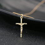 Gold-plated cross pendant close-up