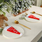 Christmas table setting with festive hat and cutlery decoration