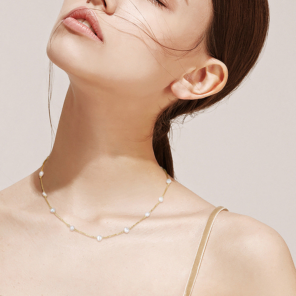 Sterling silver pearl cross chain necklace laid flat for size reference