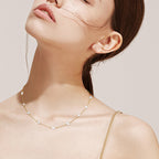 Sterling silver pearl cross chain necklace laid flat for size reference