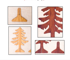 Set of carved wood Christmas tree ornaments displayed on rustic table surface