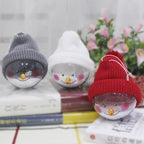 Plastic snowman Christmas pendant displayed as tree ornament