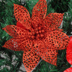 Festive Christmas arrangement with rattan, greenery, and glitter flower ornaments