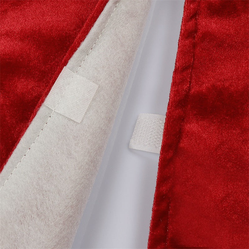 Red velvet tree skirt with snowflake design laid flat showing 48-inch circular shape