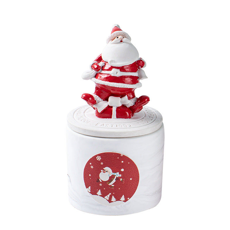 Festive Christmas aromatherapy candle with soft candlelight and seasonal design
