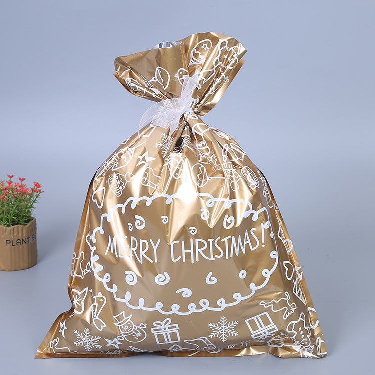 Colorful Christmas gift bags with bows in blue gold green