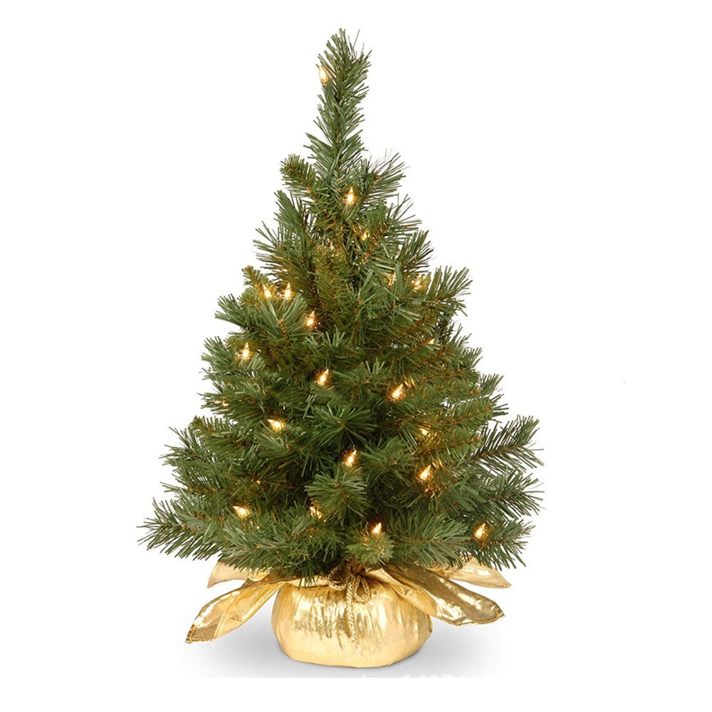 Golden mini Christmas tree on white background for desktop decoration
