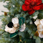 Grouping of three flannel Christmas flower ornaments in festive colors
