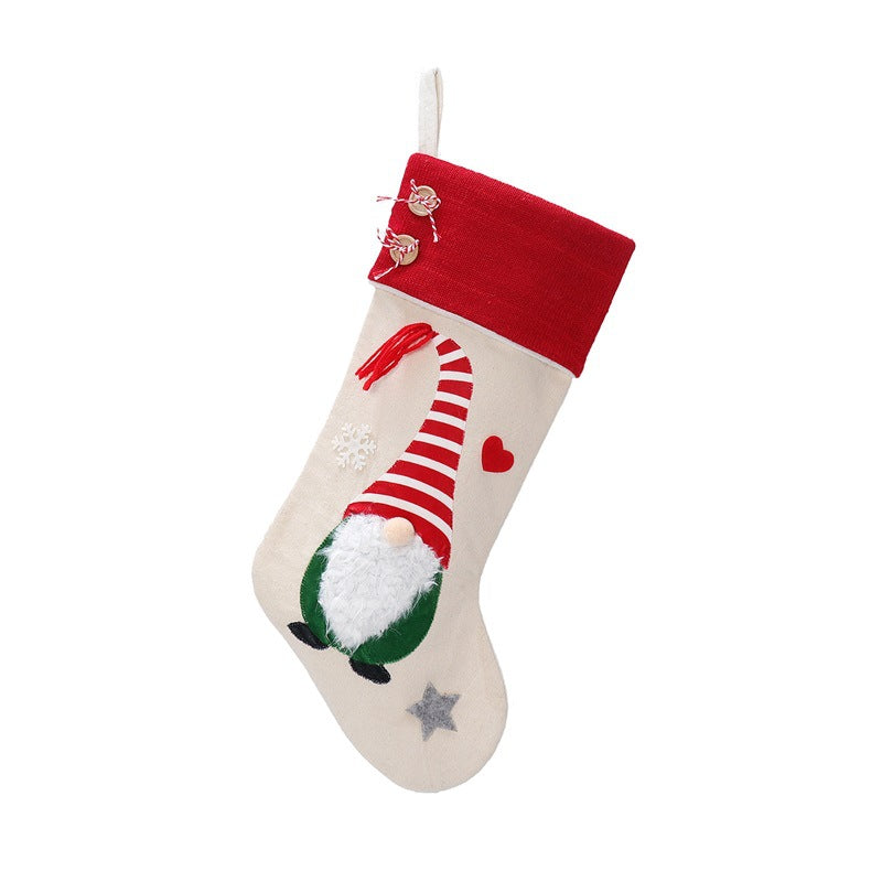 Nordic striped red hat Christmas gift bag with sock design for festive holiday gifting Main image