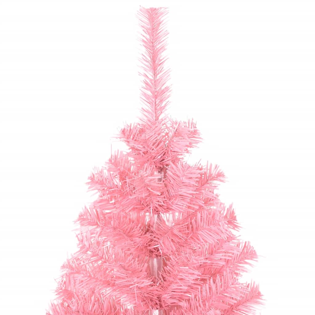Stylish pink Christmas tree as holiday centerpiece in home setting
