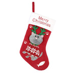 Green Christmas stocking gift bag featuring adorable kitten cartoon motif