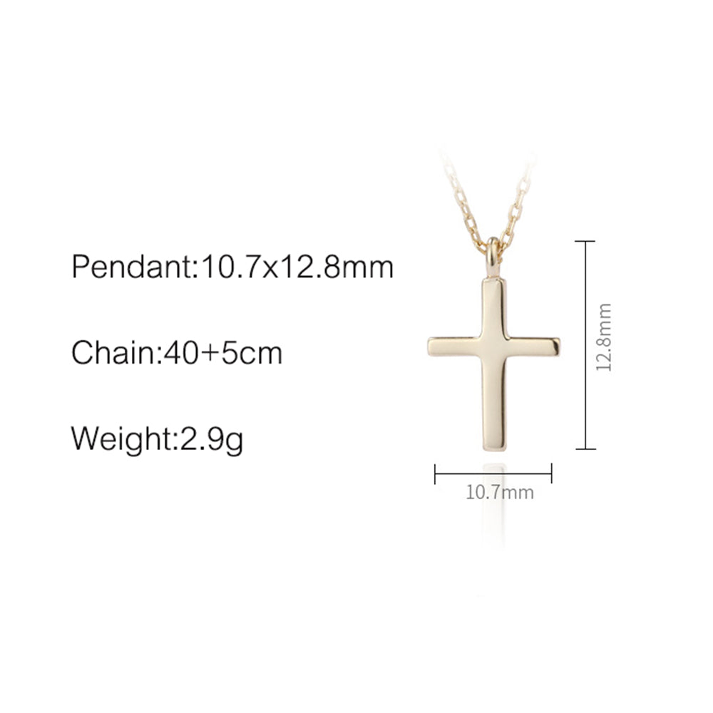 Close-up of polished sterling silver cross pendant showing intricate detail