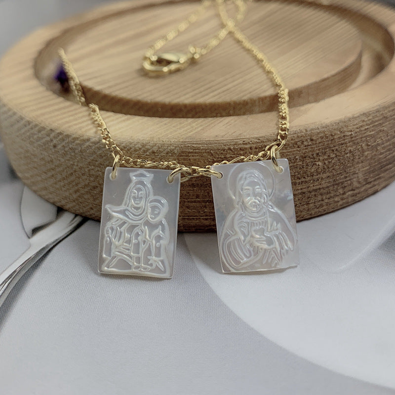Mother of pearl Virgin Jesus pendant catching light in detail view