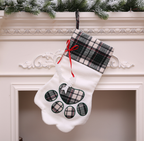 Festive dog paw Christmas stocking with cozy winter feel