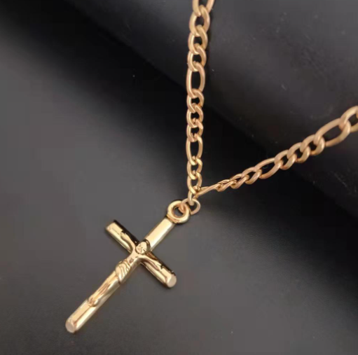 Cross pendant necklace displayed flat against a soft surface with spiritual elegance