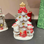 Small glowing ceramic ornament with pine and bow designs for holiday decorating