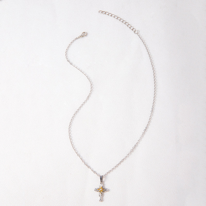 Cross flower pendant displayed against natural background