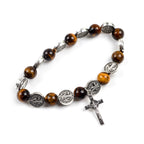 Saint Benedict Tiger Eye Rosary Bracelet laid flat displaying 8mm tiger eye beads and 23x12mm zinc alloy cross