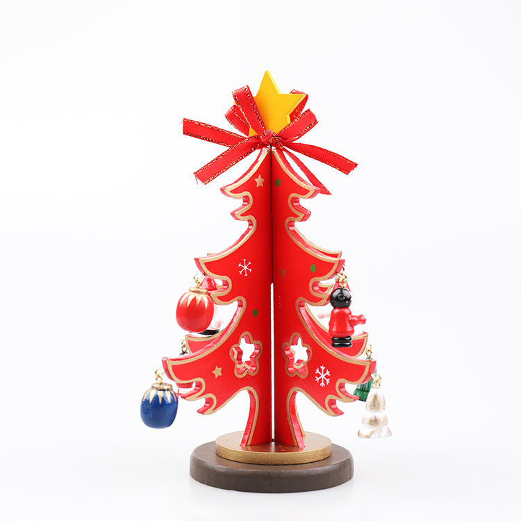 Wooden Christmas tree ornament with holly and festive details painted in red and green
