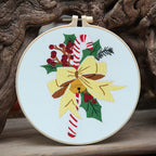Festive gingerbread house design on round Christmas pendant frame in studio setting