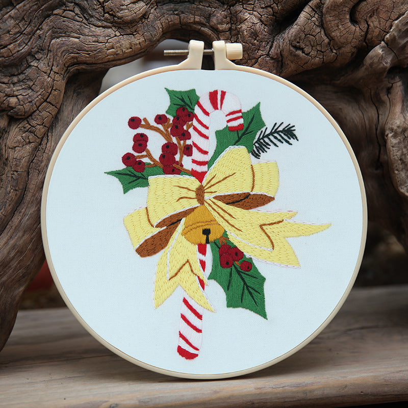 Festive gingerbread house design on round Christmas pendant frame in studio setting