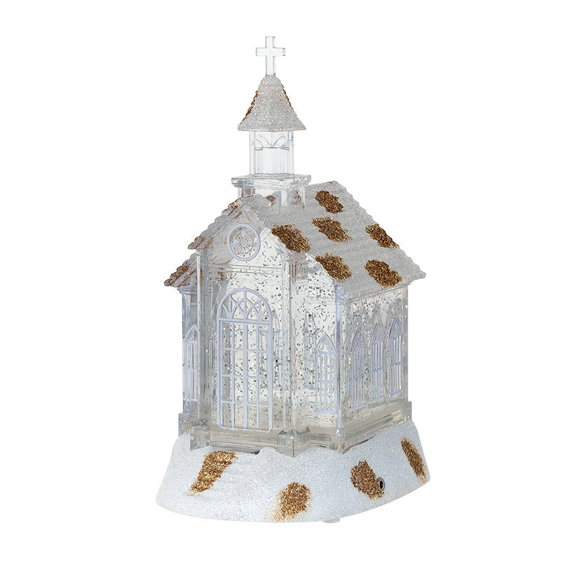 Crystal church music box ornament displayed on a Christmas tree branch with lights