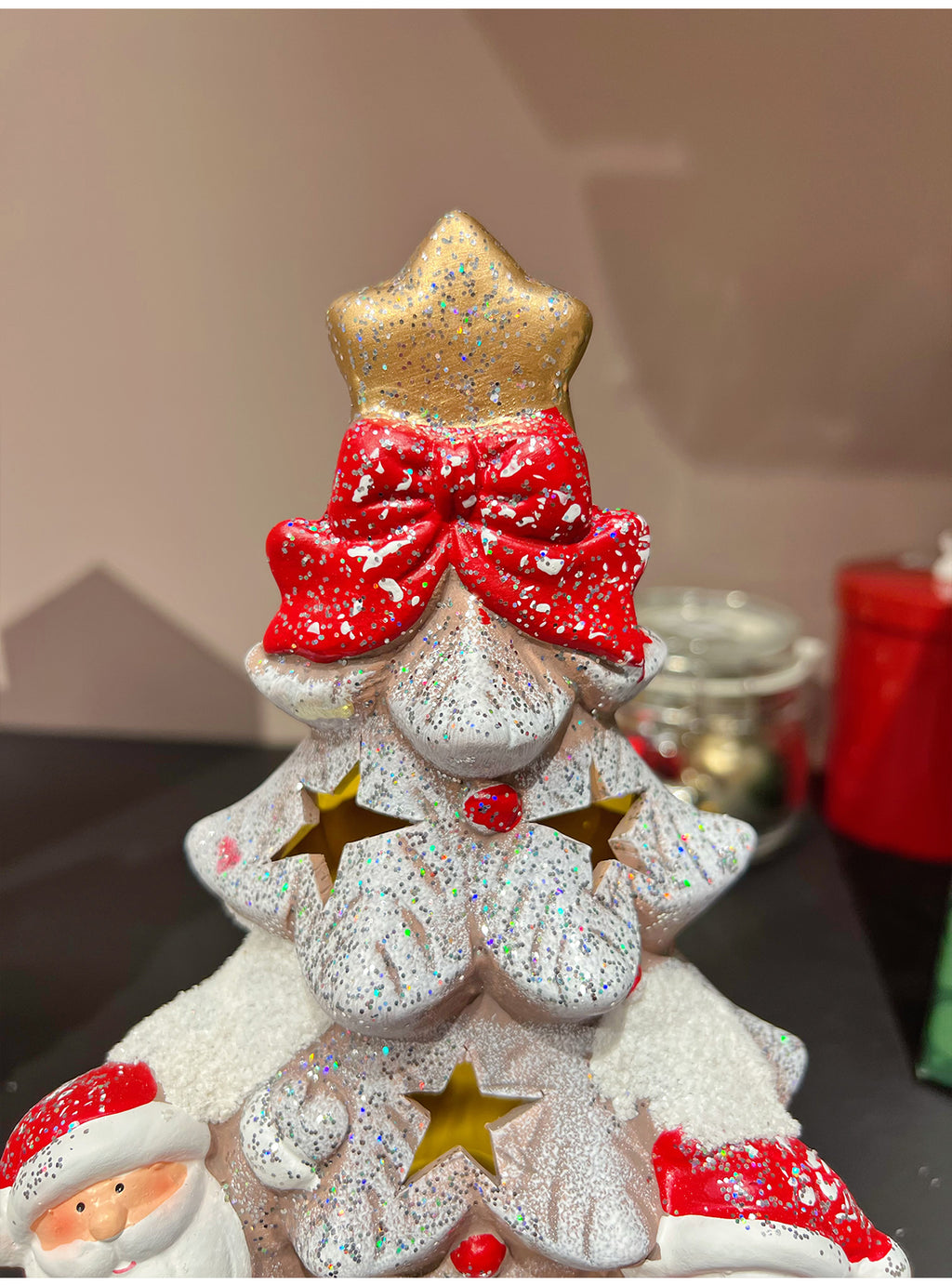 Festive ceramic snow house decoration with soft illumination for Christmas display