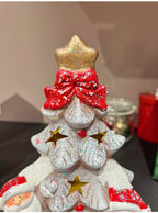 Festive ceramic snow house decoration with soft illumination for Christmas display