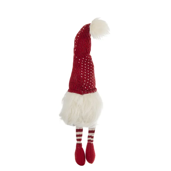 Set of two tall festive gnome figurines with white beards and red pointed hats standing on a festive surface