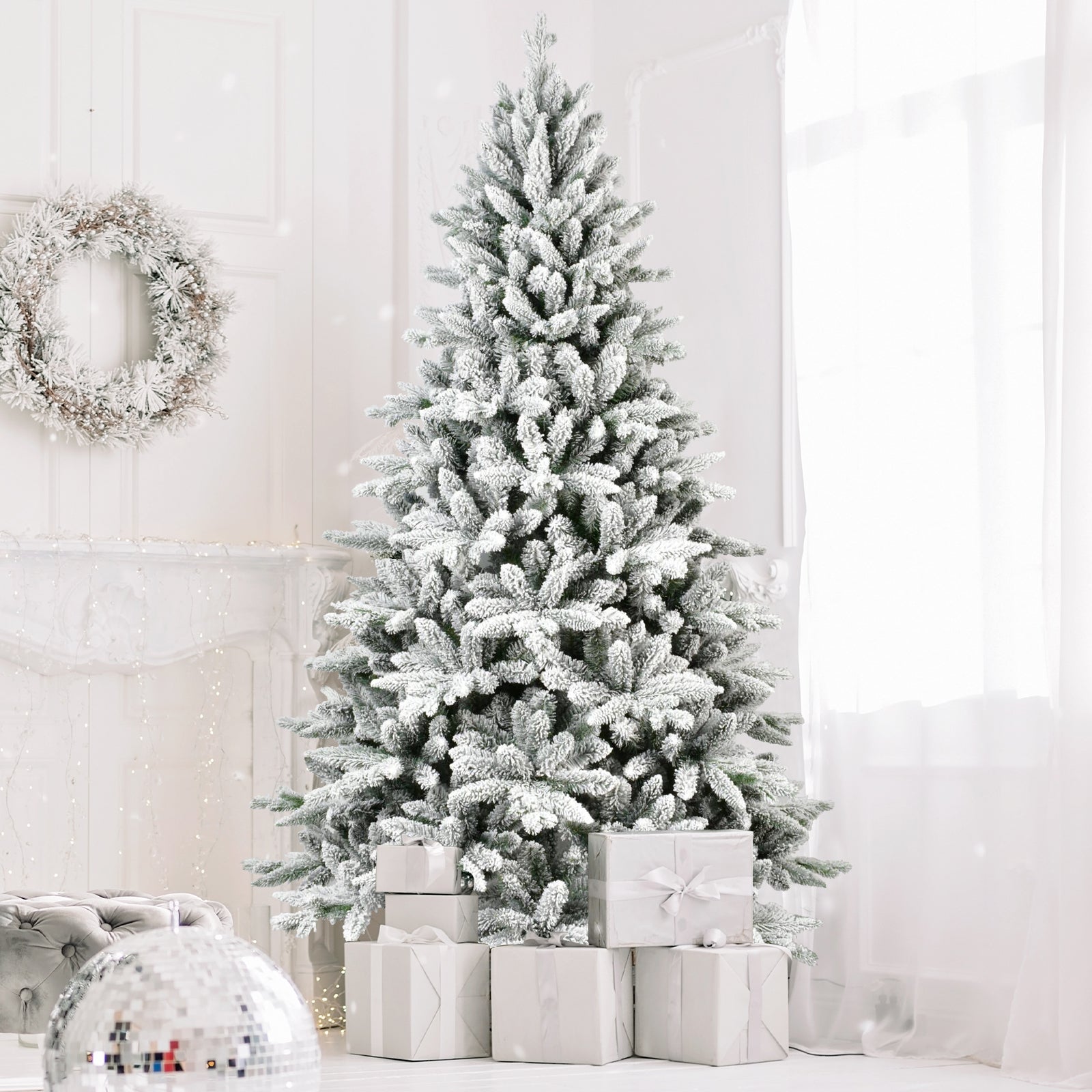 Fully decorated PVC Christmas tree with festive ornaments and warm lighting in a home setting Main image
