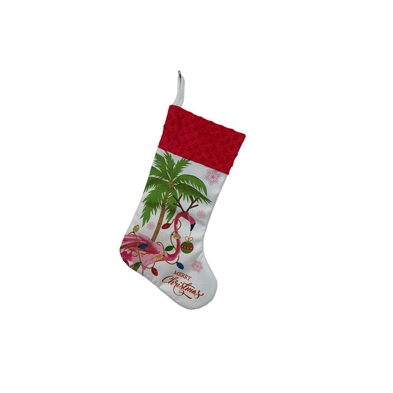 Christmas stocking featuring flamingo and holiday elements