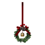 Close-up view of festive bell garland ornament showing pine cone and leaf details