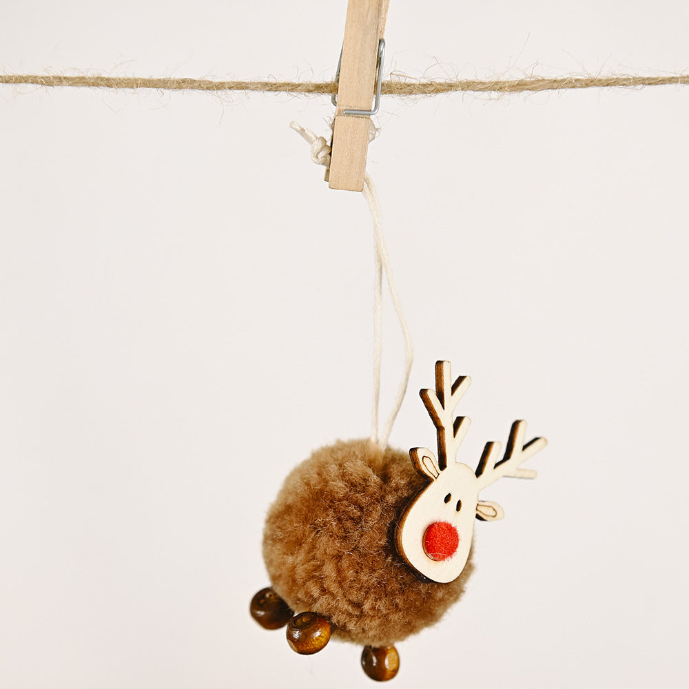 Elk and Christmas tree cloth pendant in warm holiday tones