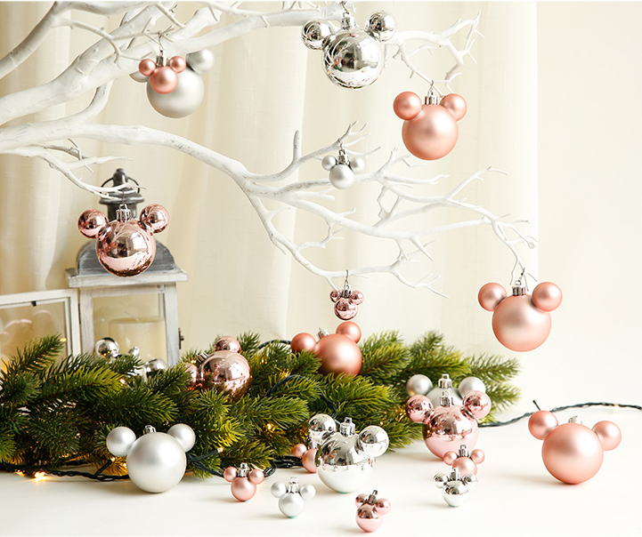 Close-up of red and gold Christmas reindeer ornament pendants - Festive Holiday Decorations