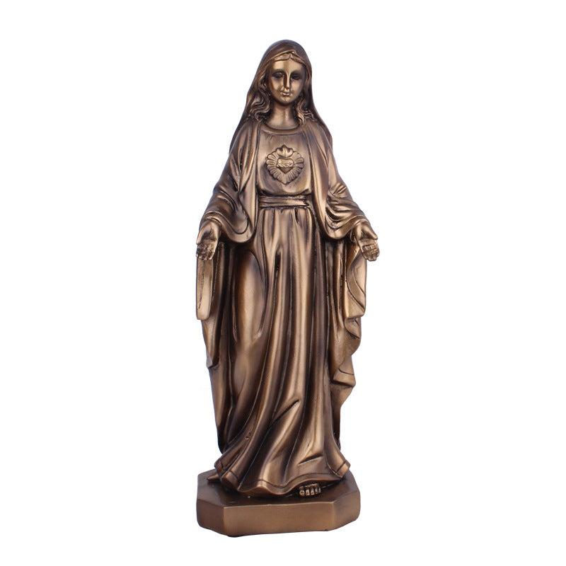 Resin Jesus ornament displayed as home decor piece with warm tones