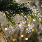 Close-up of detailed angel wing detail on transparent Christmas pendant
