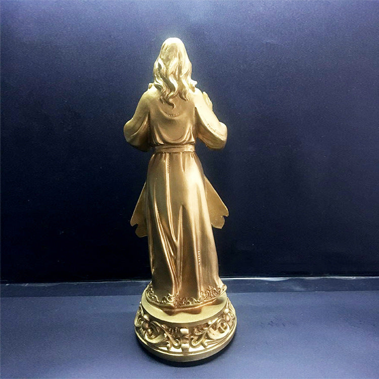 Bright gold Jesus Mercy resin sculpture standing on decorative base