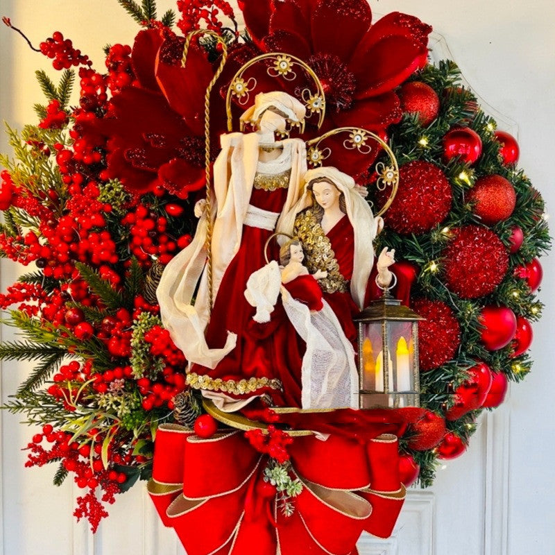 Ornate Christmas wreath featuring Jesus with warm bulb lights for door or wall display