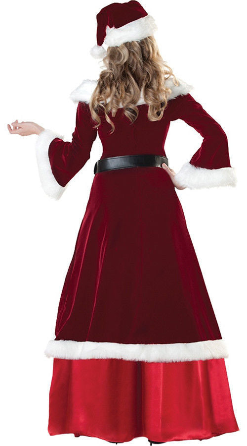 Christmas couple wearing matching Santa costumes smiling