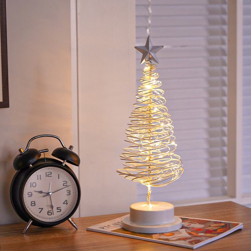 Christmas tree shaped light ornament with subtle warm illumination