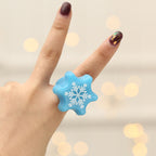 Close-up of Christmas finger light ring with battery compartment
