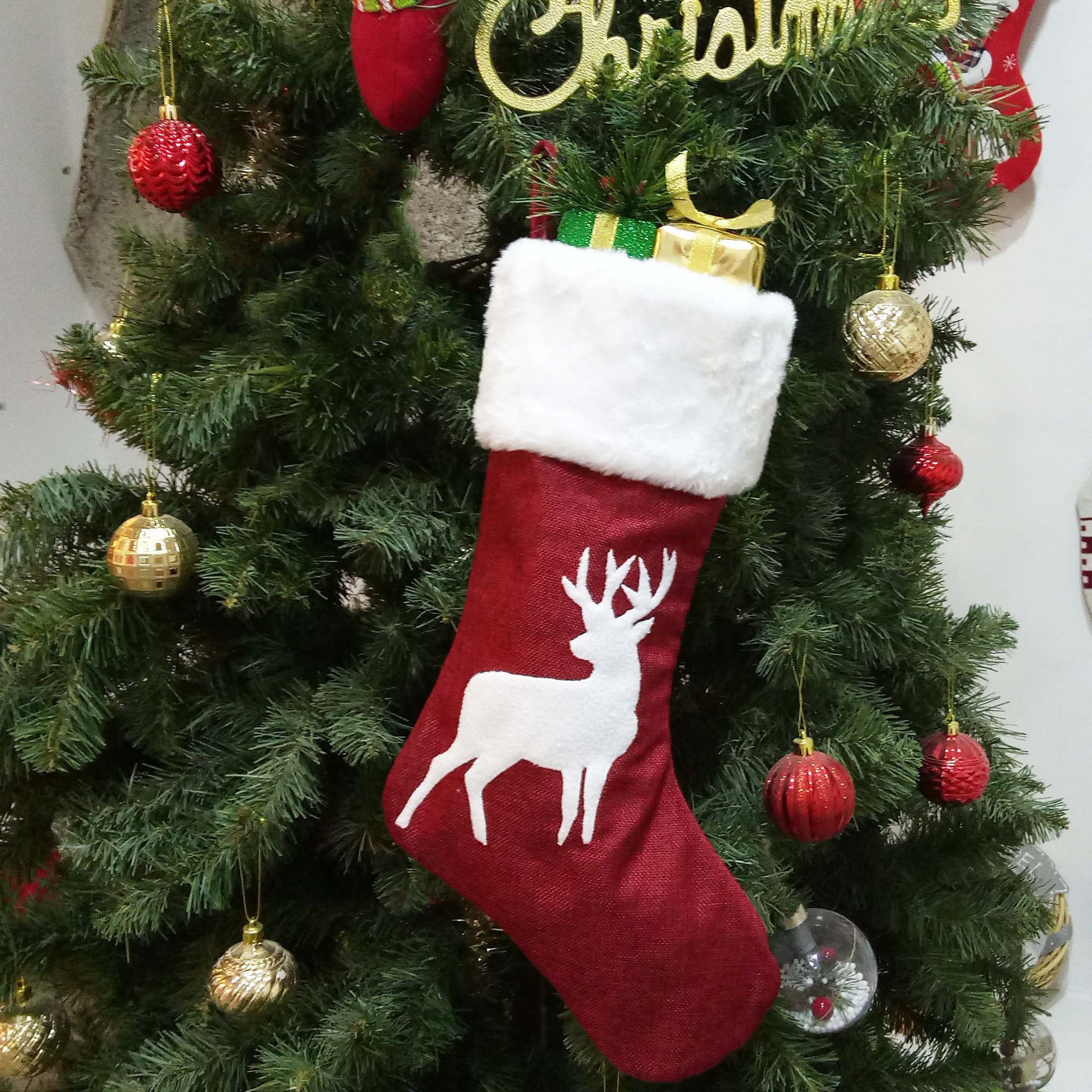 Christmas sock gift bag shown as reusable holiday gift packaging