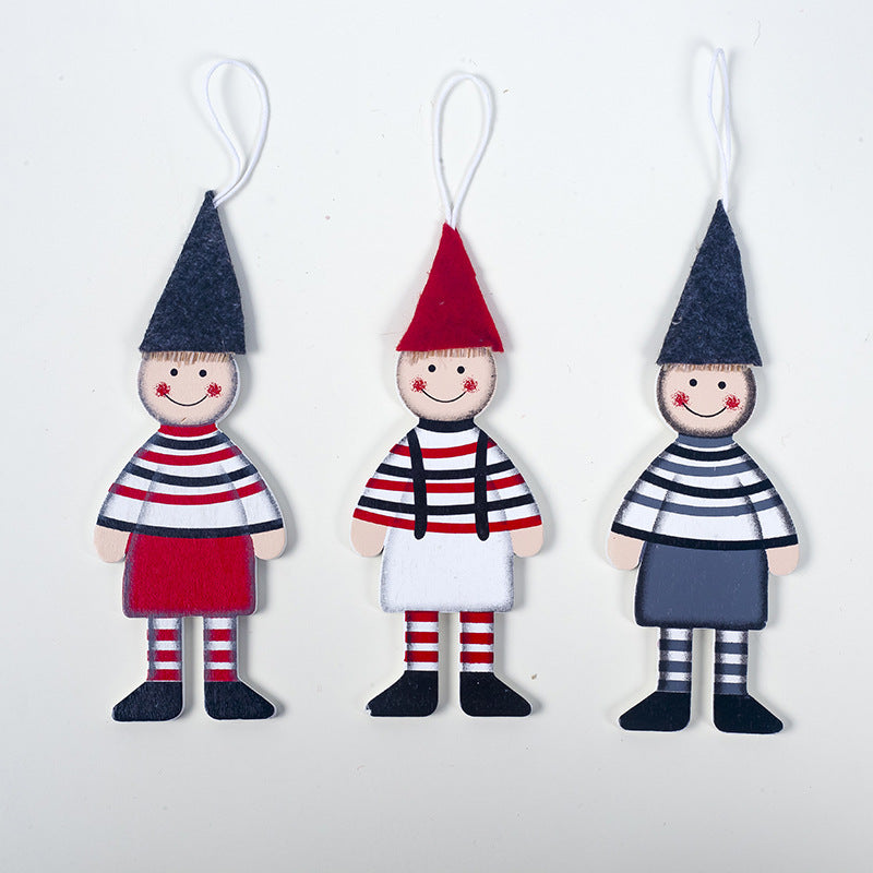 Christmas tree ornaments featuring printed wooden boy and girl figures