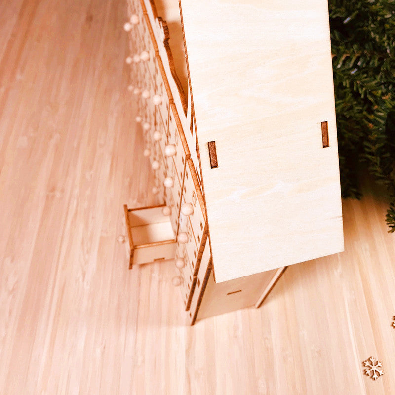 Handcrafted basswood advent calendar ready for Christmas family traditions
