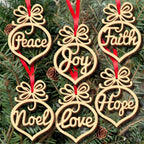 Wooden Christmas pendants arranged on Christmas tree branches