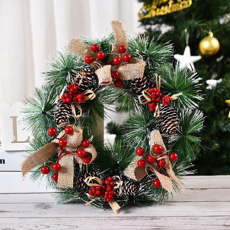 Christmas garland displaying three flowers and winter elements