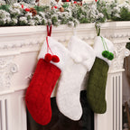 Knitted Christmas sock ornament adding warmth to decorated Christmas tree
