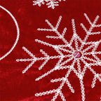 Festive red and white Christmas tree skirt with lace trim detail for holiday decorating