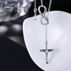 Woman wearing geometric cross pendant necklace